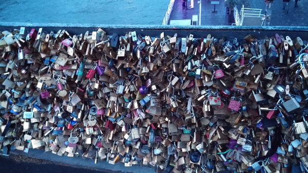 Banister with lots of locks.