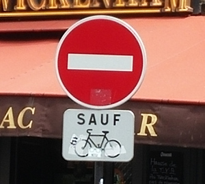 No-entry-sign with SAUF and a bicycle under it